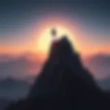 Silhouette of person standing on mountain peak at sunrise