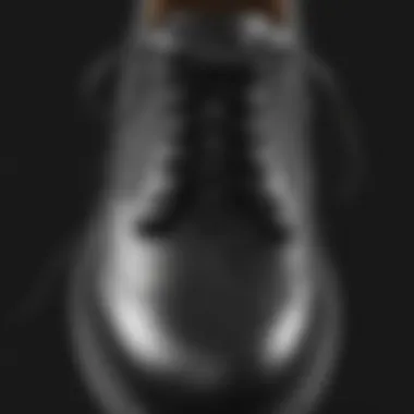 Elegant shoelace knot on black leather shoe