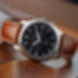 A close-up view of a luxurious brown leather strap watch resting on a wooden surface